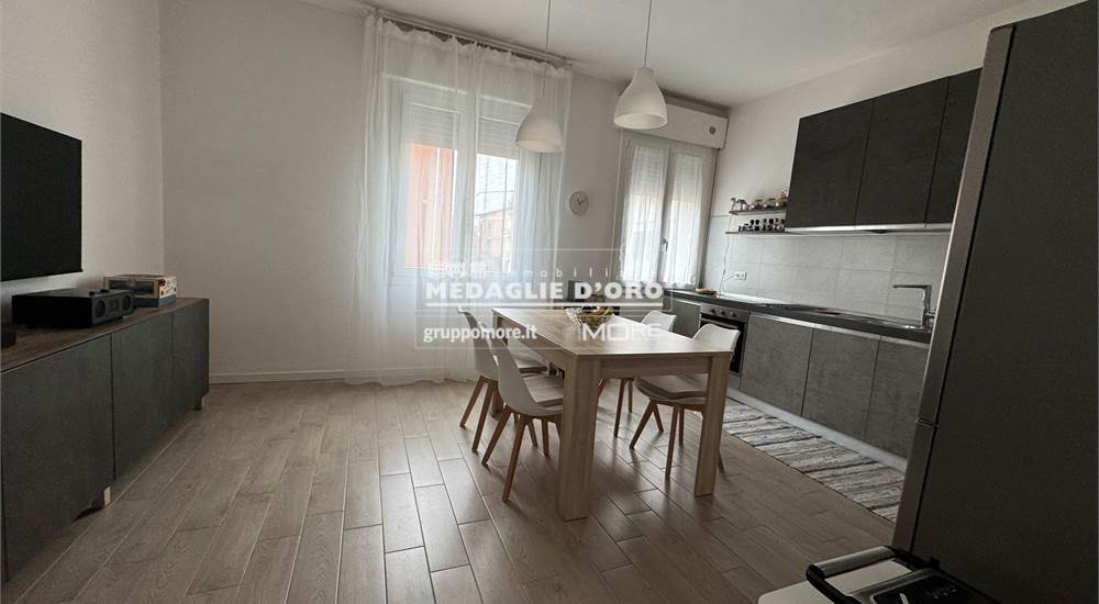 SALA CON CUCINA A VISTA
